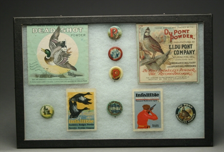 Display of 6 pinbacks and 2 shotshell box inserts and 2 promotional stamps.