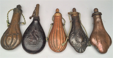 Lot of 5 powder flasks, last half 19th century.