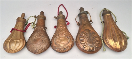Lot of 5 powder flasks, last half 19th century.